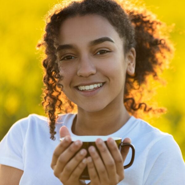 Mixed Race African American Teenager Woman Drinking Tea